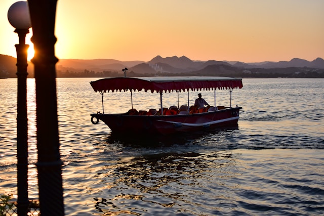 Boats floating on the Ganga River during sunrise